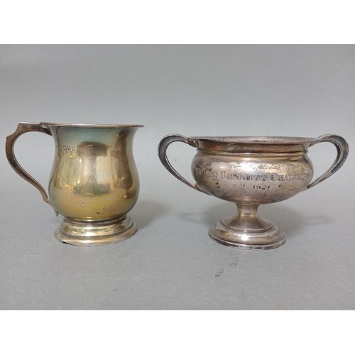 99 - A hallmarked silver twin handled trophy cup 