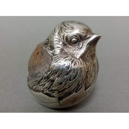 102 - A large Edwardian silver pin cushion, modelled in the form of a chick, stamped Rd 475678, Chester, 1... 