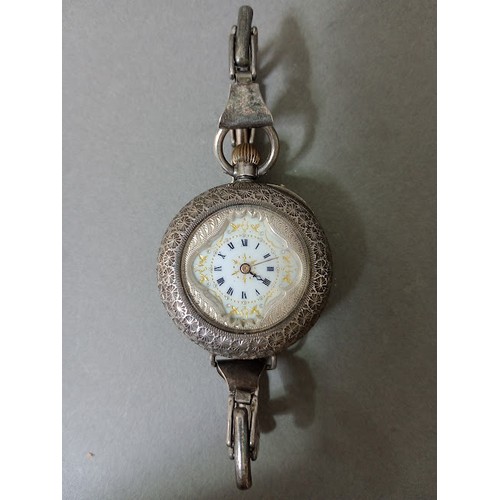 104 - A ladies silver wristwatch, marked 0.935.