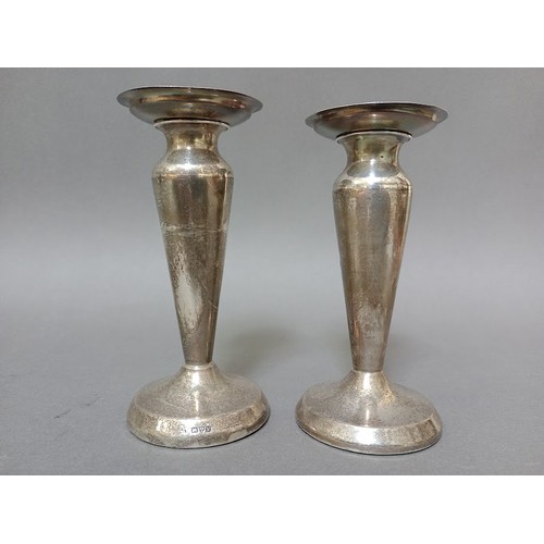 105 - A pair of hallmarked silver vases/candlesticks, Chester, possibly J & R Griffin (Joseph & Richard Gr... 