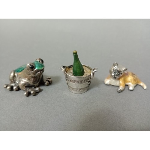 126 - A silver and green enamel frog, marked 925 together with a silver and enamel cat and a silver charm ... 