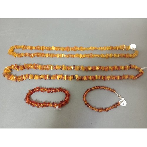 128 - A collection of amber / butterscotch amber necklaces and bracelets, gross weight 75 grams.