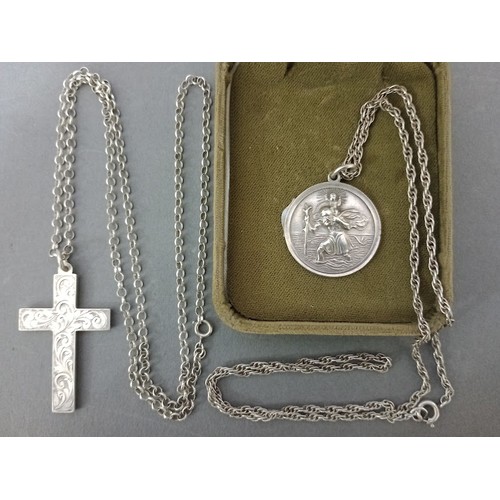 129 - Two silver religious necklaces, a crucifix on silver chain dated 1916 and a St Christopher pendant o... 