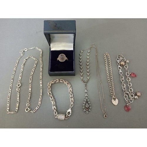 130 - A vintage pearls and silver necklace, a silver ring, 3 silver bracelets and a silver chain, gross we... 