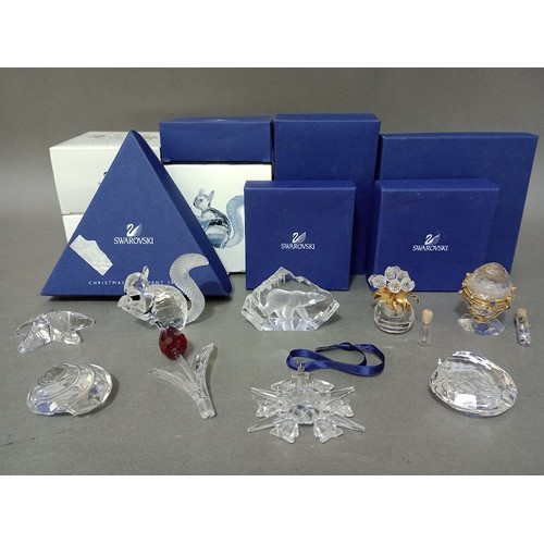 149 - Nine Swarovski crystal ornaments, all with boxes.