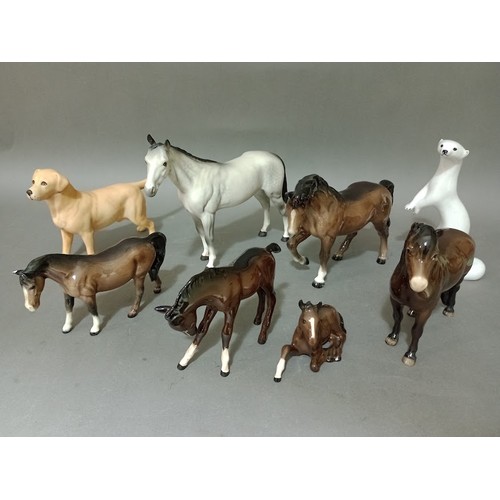 154 - Six Beswick horses, a Beswick dog and a Russian otter.