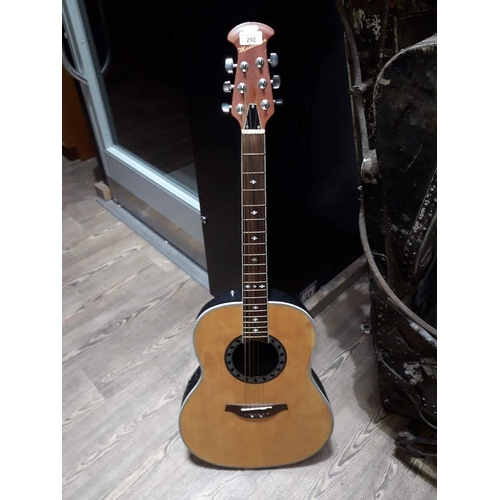 292 - A Manhattan electro-acoustic steel strung guitar with round back and with hard case