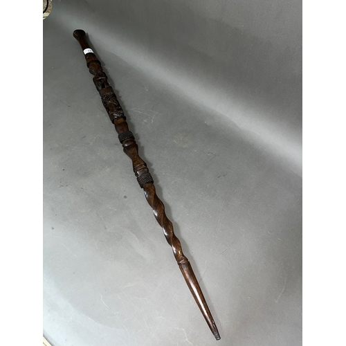 13 - An African carved hardwood walking stick, length 100cm.