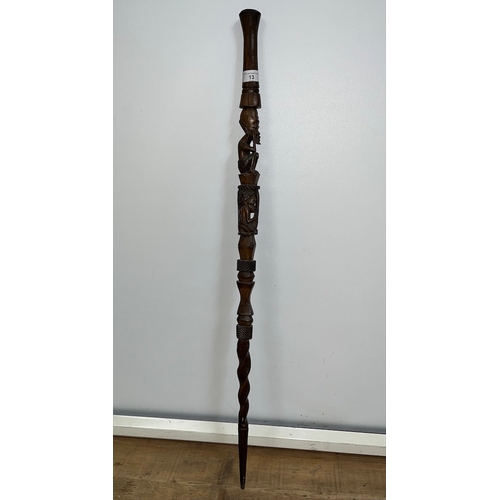 13 - An African carved hardwood walking stick, length 100cm.