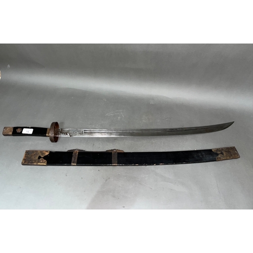 14 - A Chinese sword, double fullered and etched blade, brass mounted wooden handle and scabbard, total l... 