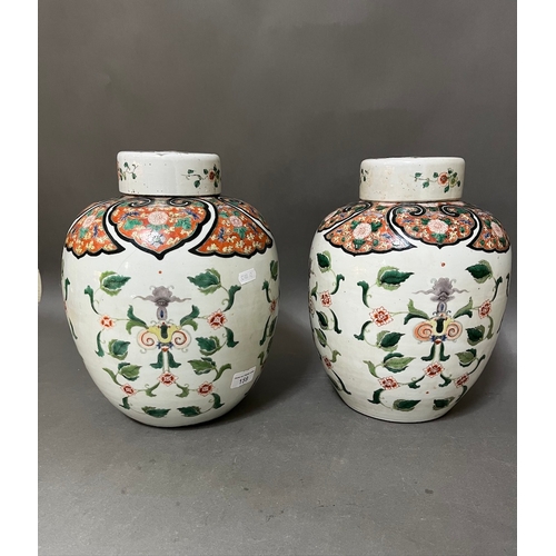 159 - An associated pair of Chinese porcelain ginger jars with lids, one bearing four character Kangxi mar... 