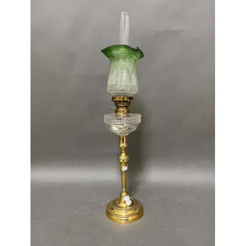 161 - A late Victorian brass and green glass peg lamp.