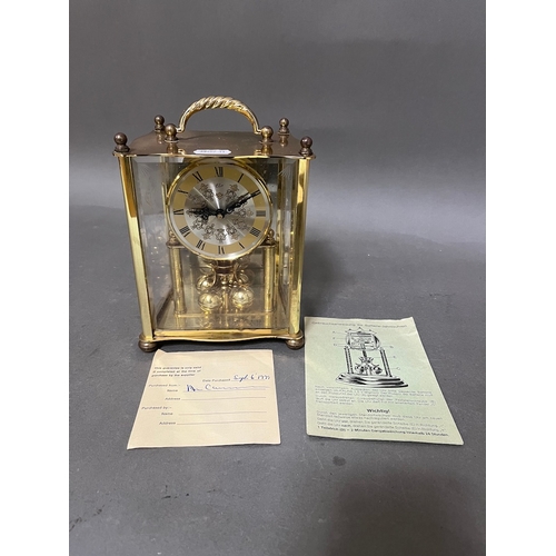 171 - A German Elo revolving pendulum clock.