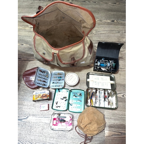 197 - A Brady Halesowen fishing bag containing various fishing tackle, lures, an Abu Ambassadeur G500C Swe... 