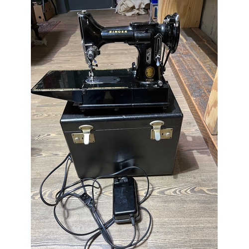 206 - A Singer 222K Featherweight electric sewing machine, circa 1954, with box, power lead and pedal.