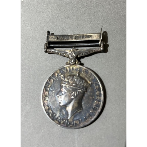 214 - A George VI Palestine Police medal awarded to 1890 Constable A. G. Burnell.