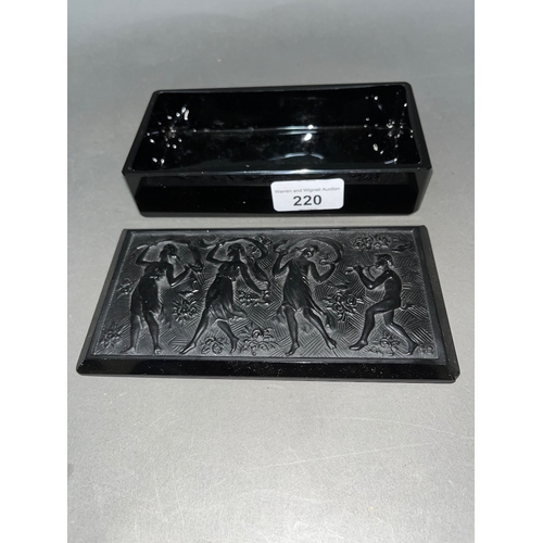 220 - A Baccarat black glass casket depicting dancing maidens.