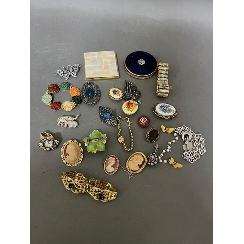 226 - A mixed lot of costume jewellery, yellow metal, two vintage compacts etc.