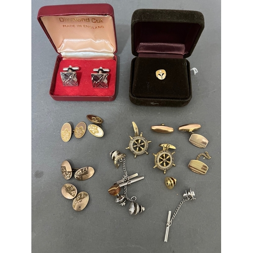 228 - Assorted cuff-links and a diamond set pin.