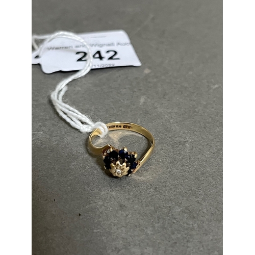 242 - A 9ct gold sapphire and diamond ring.