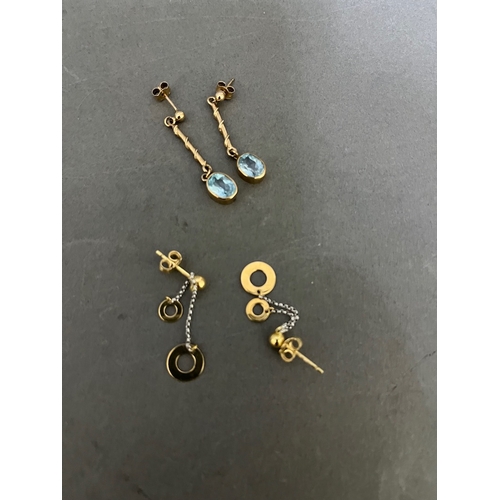 250 - A pair of 9ct gold earrings with topaz stones and a pair of 9ct yellow and white gold drop earrings.