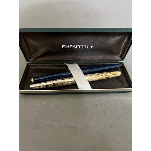 251 - A Sheaffer fountain pen with 14ct gold nib and a Parker pen with a Sheaffer associated box.