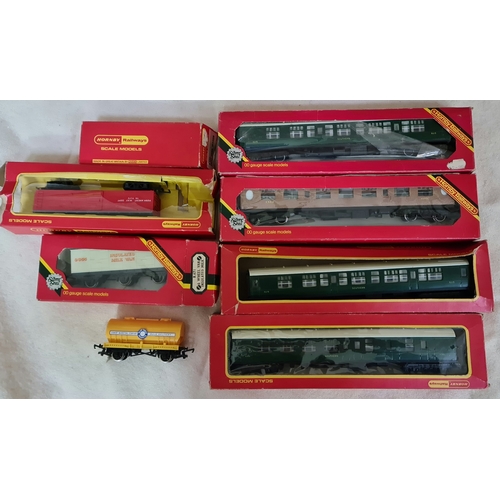 345 - A collection of Hornby railways items to include Shell tank wagons, insulated milk van, 2 composite ... 