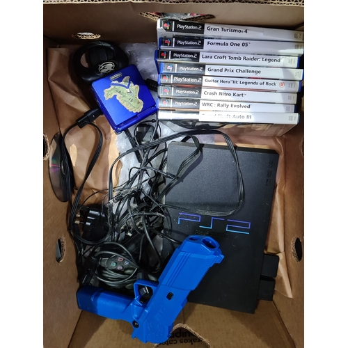 349 - A PS2 console with 2 controllers, various PS2 games, a Sega pistol and a Nintendo GameBoy Advance SP... 