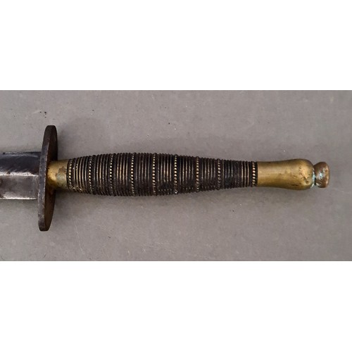 96 - Military interest - a WW2 Fairbairn-Sykes commando fighting knife / dagger, double-edged, with brass... 