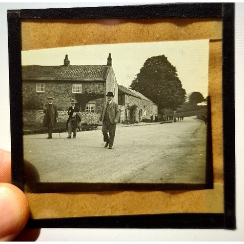 193 - A case containing approx. 200+ early 20th century magic lantern type slides.