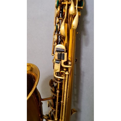 281 - A Buescher alto saxophone with hard case.