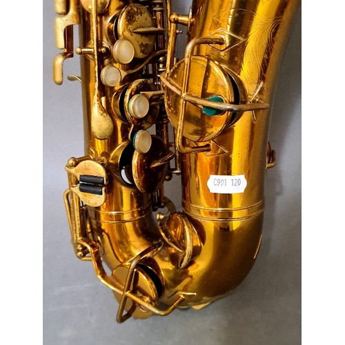 281 - A Buescher alto saxophone with hard case.