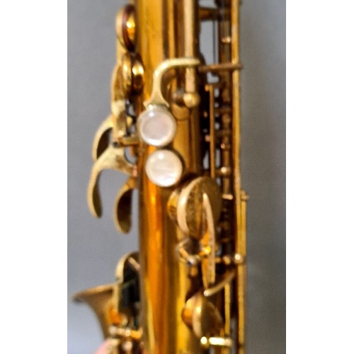 281 - A Buescher alto saxophone with hard case.