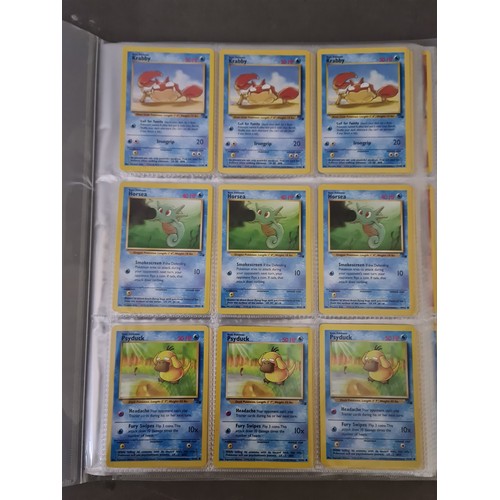 340 - A box containing two binders of vintage 1990s Pokemon cards together with a vintage Pokemon marble b... 