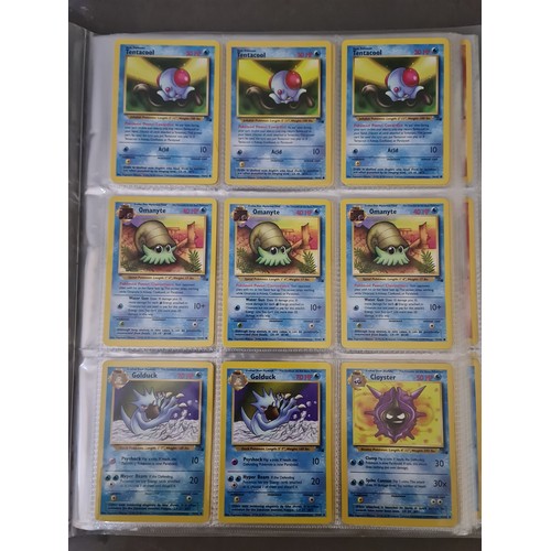 340 - A box containing two binders of vintage 1990s Pokemon cards together with a vintage Pokemon marble b... 