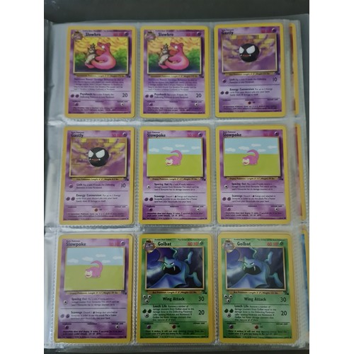 340 - A box containing two binders of vintage 1990s Pokemon cards together with a vintage Pokemon marble b... 