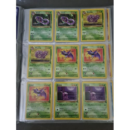 340 - A box containing two binders of vintage 1990s Pokemon cards together with a vintage Pokemon marble b... 