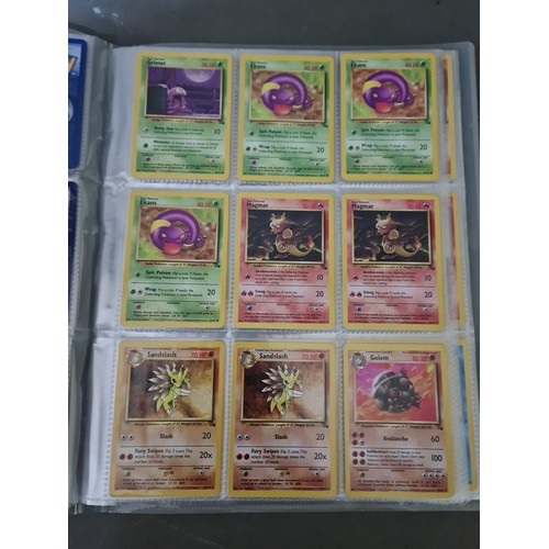 340 - A box containing two binders of vintage 1990s Pokemon cards together with a vintage Pokemon marble b... 