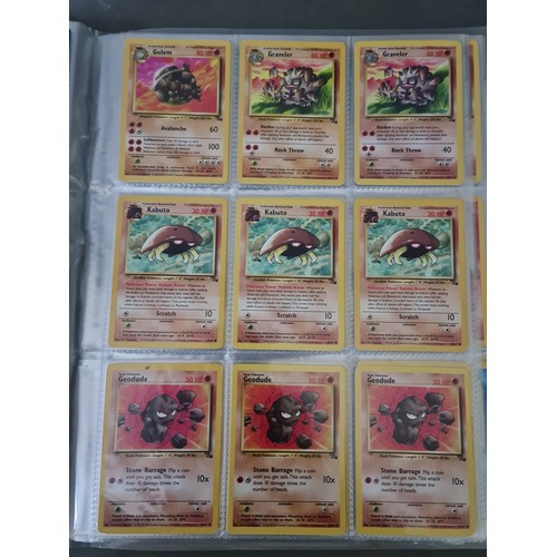 340 - A box containing two binders of vintage 1990s Pokemon cards together with a vintage Pokemon marble b... 