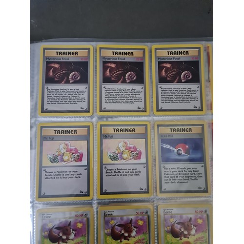 340 - A box containing two binders of vintage 1990s Pokemon cards together with a vintage Pokemon marble b... 