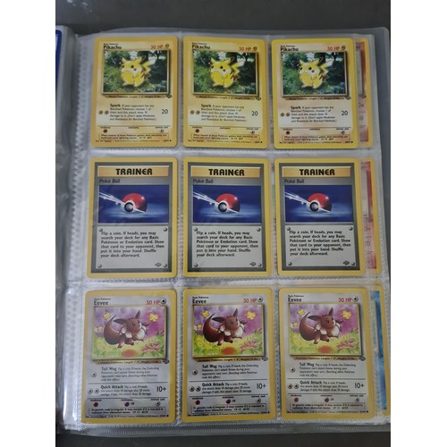 340 - A box containing two binders of vintage 1990s Pokemon cards together with a vintage Pokemon marble b... 