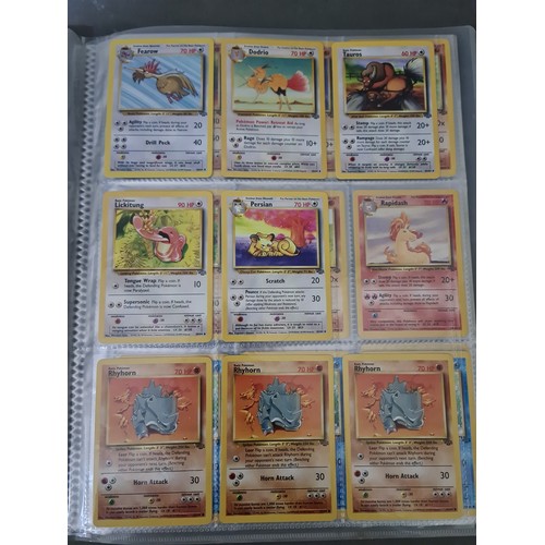 340 - A box containing two binders of vintage 1990s Pokemon cards together with a vintage Pokemon marble b... 