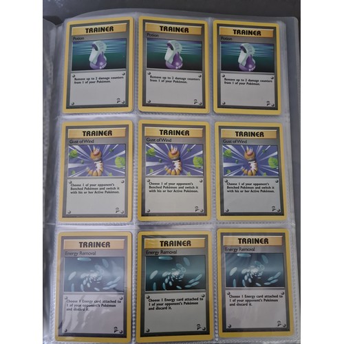 340 - A box containing two binders of vintage 1990s Pokemon cards together with a vintage Pokemon marble b... 