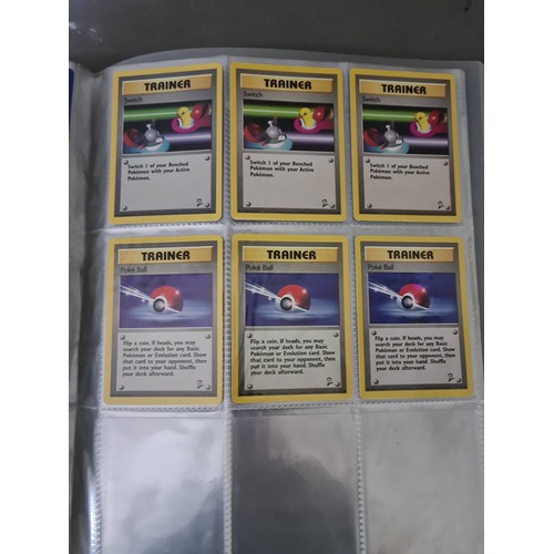 340 - A box containing two binders of vintage 1990s Pokemon cards together with a vintage Pokemon marble b... 