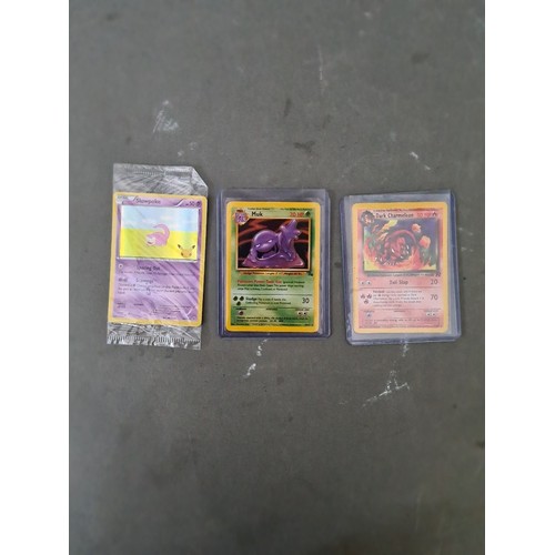 340 - A box containing two binders of vintage 1990s Pokemon cards together with a vintage Pokemon marble b... 