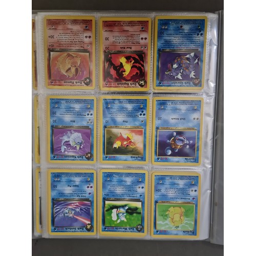 340 - A box containing two binders of vintage 1990s Pokemon cards together with a vintage Pokemon marble b... 