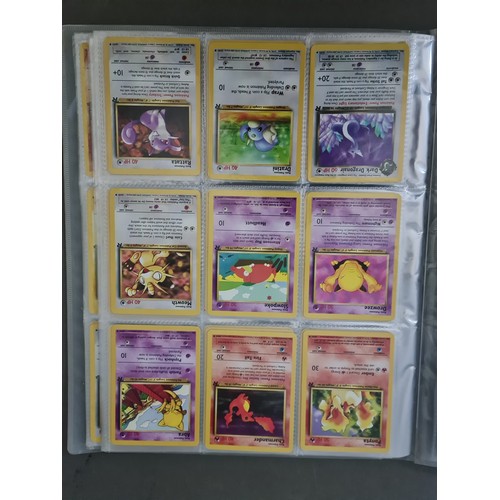 340 - A box containing two binders of vintage 1990s Pokemon cards together with a vintage Pokemon marble b... 