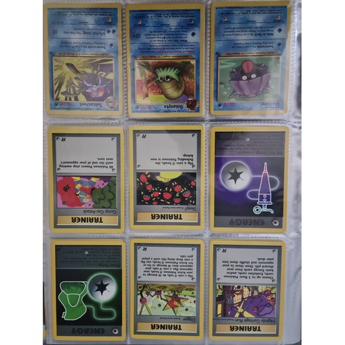 340 - A box containing two binders of vintage 1990s Pokemon cards together with a vintage Pokemon marble b... 