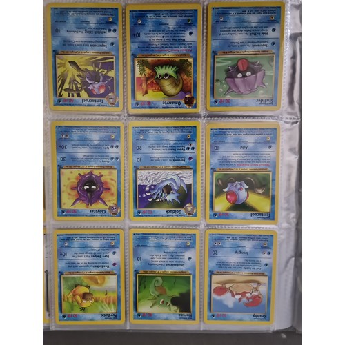 340 - A box containing two binders of vintage 1990s Pokemon cards together with a vintage Pokemon marble b... 