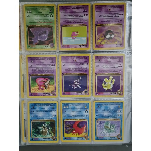 340 - A box containing two binders of vintage 1990s Pokemon cards together with a vintage Pokemon marble b... 